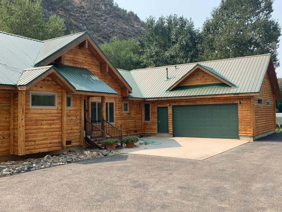 Finished wood-sided home and attached garage